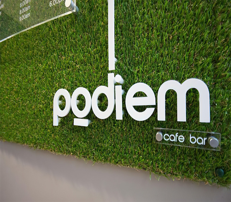Examples of signage designs using synthetic grass
